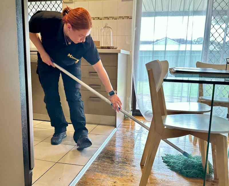 Adelaide-professional-NDIS-and-DVA-cleaner-mopping-floor Maid2Match Adelaide professionally trained NDIS cleaner and DVA cleaner Laura mopping wooden floors