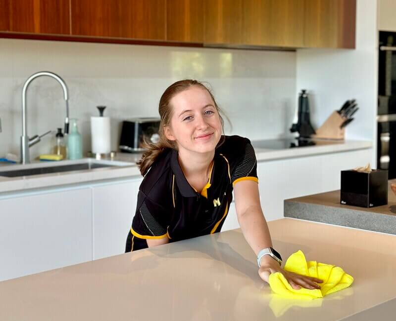 Brisbane-DVA-cleaner-wiping-benchtop Maid2Match Brisbane professional DVA house cleaner wiping benchtop