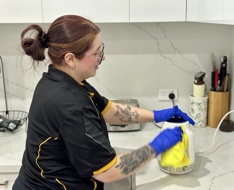 Maid2Match Geelong professional house cleaner Paris cleaning a kettle