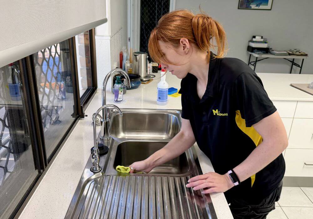 Maid2Match-cleaner-cleaning-a-kitchen-sink Maid2Match professional house cleaner cleaning a kitchen sink