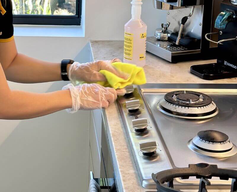 Maid2Match house cleaner cleaning stove top knobs