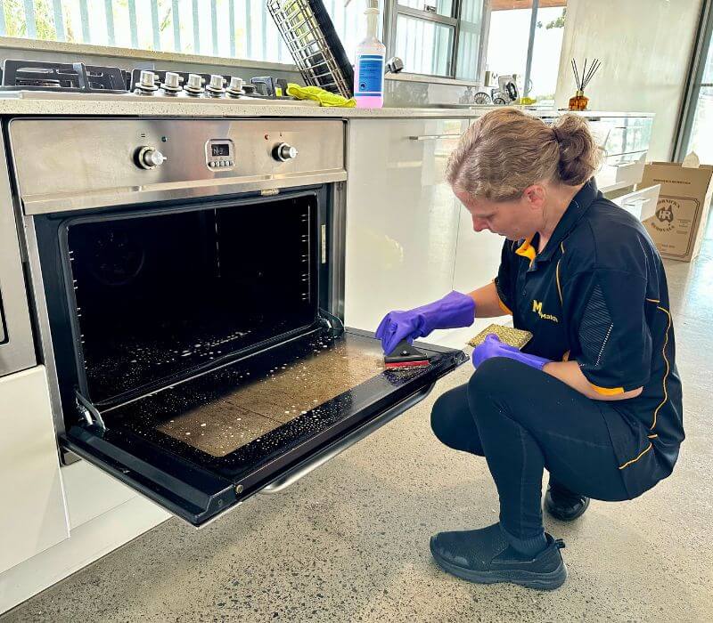 Maid2Match Brisbane fully trained house cleaner cleaning dirty oven