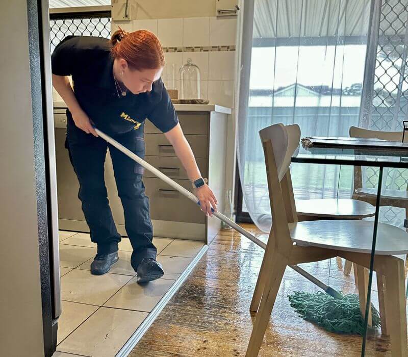 Maid2Match trusted house cleaner in Adelaide mopping wooden flooring