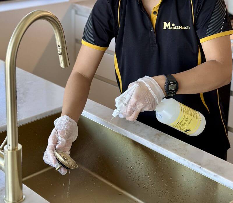 Maid2Match expert cleaner disinfecting sink and drain cover with spray cleaner