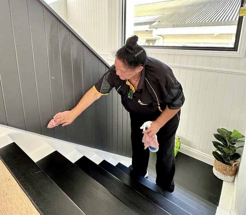 Janet cleaning the stairwell