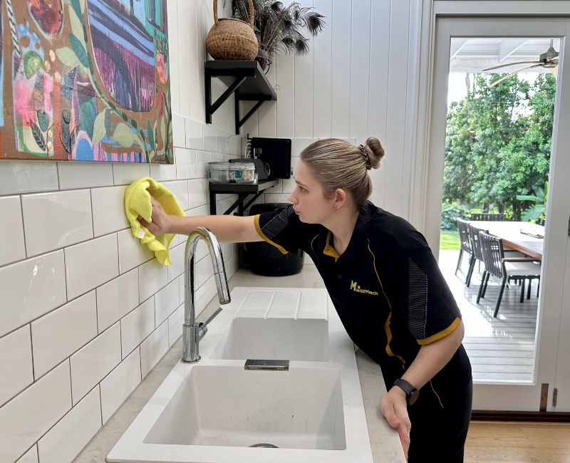 Maid2Match Brisbane house cleaner Kate-lyn cleaning kitchen splashback