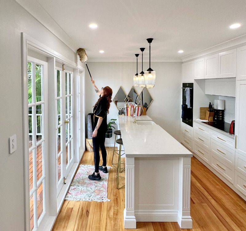 Maid2Match-professional-house-cleaner-dusting-a-room Maid2Match professional house cleaner dusting a room during spring cleaning
