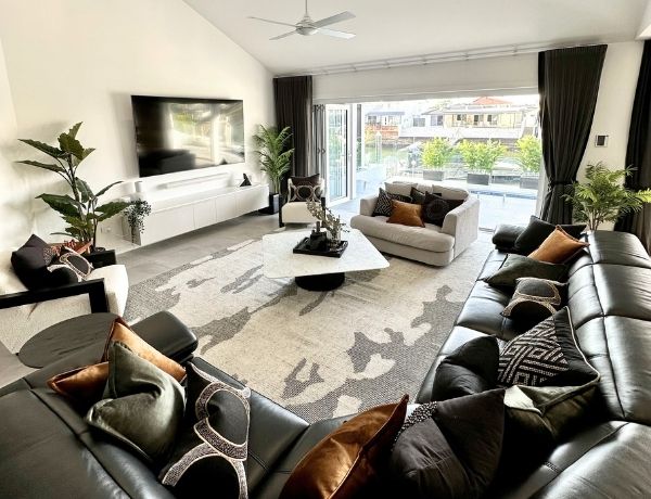 Clean living room with large couch