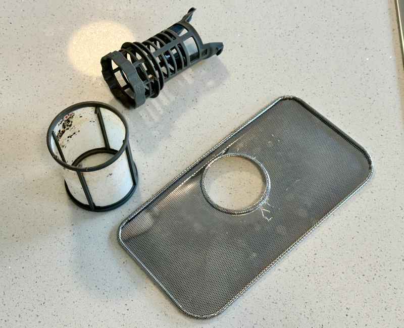removed parts of dirty dishwasher filter