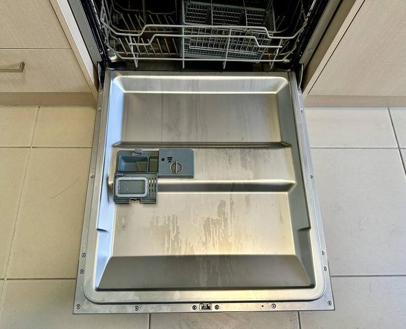 dirty dishwasher with open door