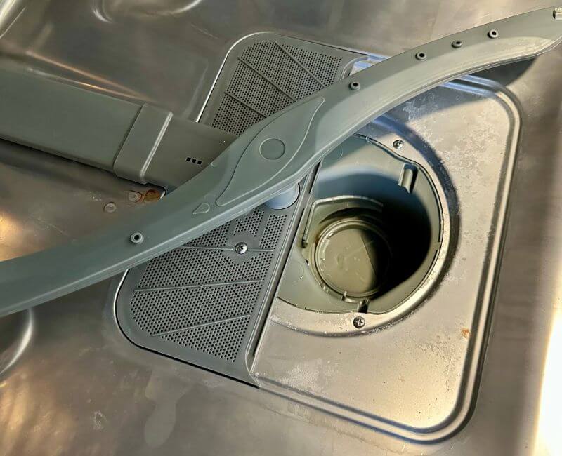 top view of a dirty dishwasher drain