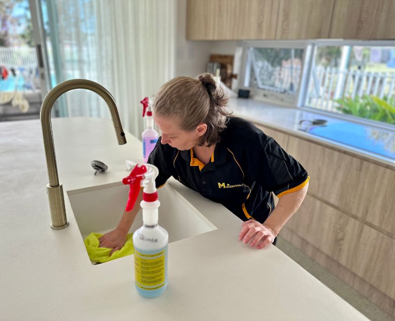 Maid2Match house cleaner in Brisbane cleaning the kitchen sink