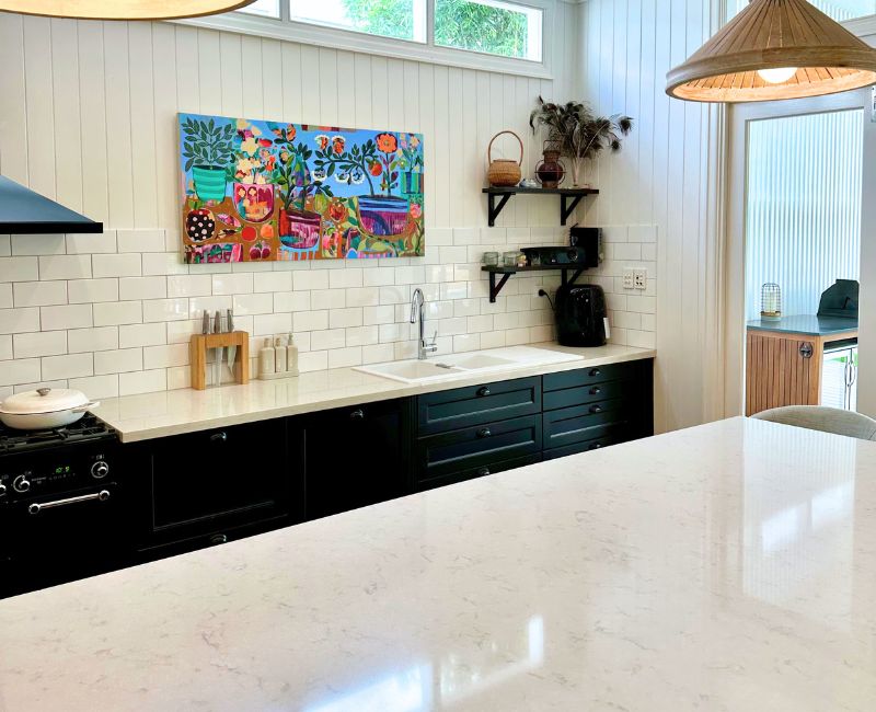 Shiny bench tops, spotless kitchen sink, and clean splashbacks after kitchen cleaning by Maid2Match house cleaner