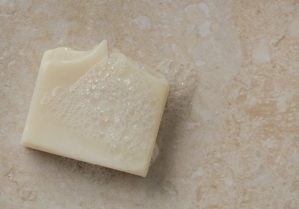 cleaning-with-castile-soap castile soap bar on a benchtop