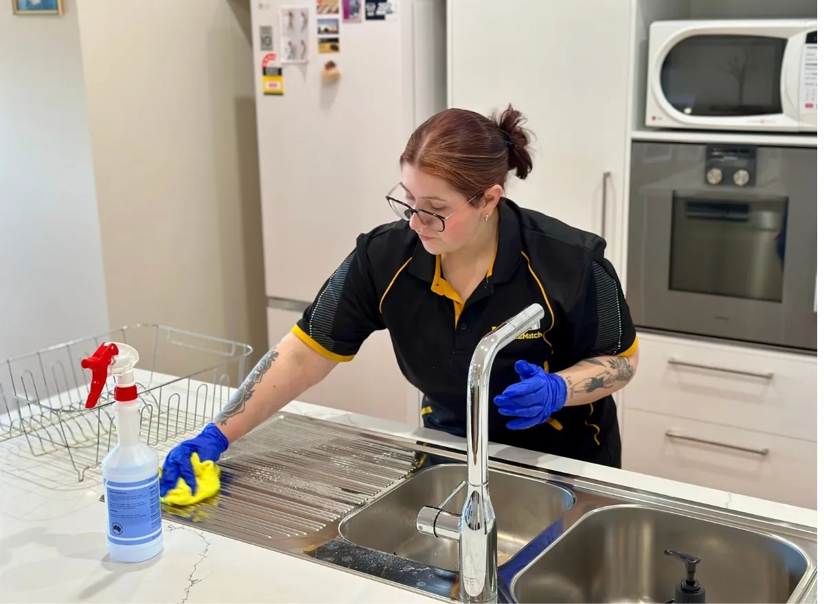 Maid2Match Geelong house cleaner wiping kitchen sink