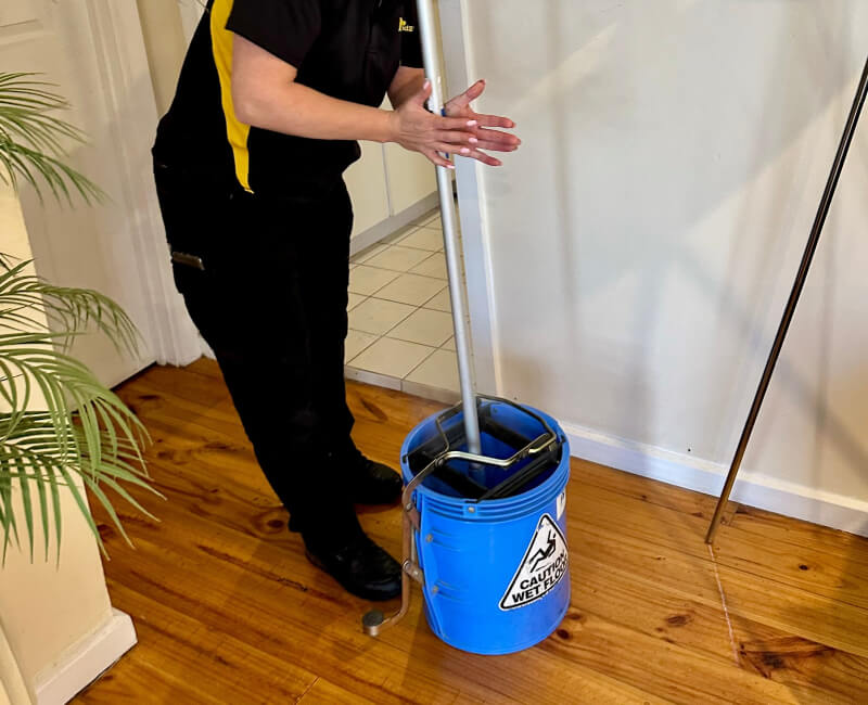 Mop dipped in cleaning solution